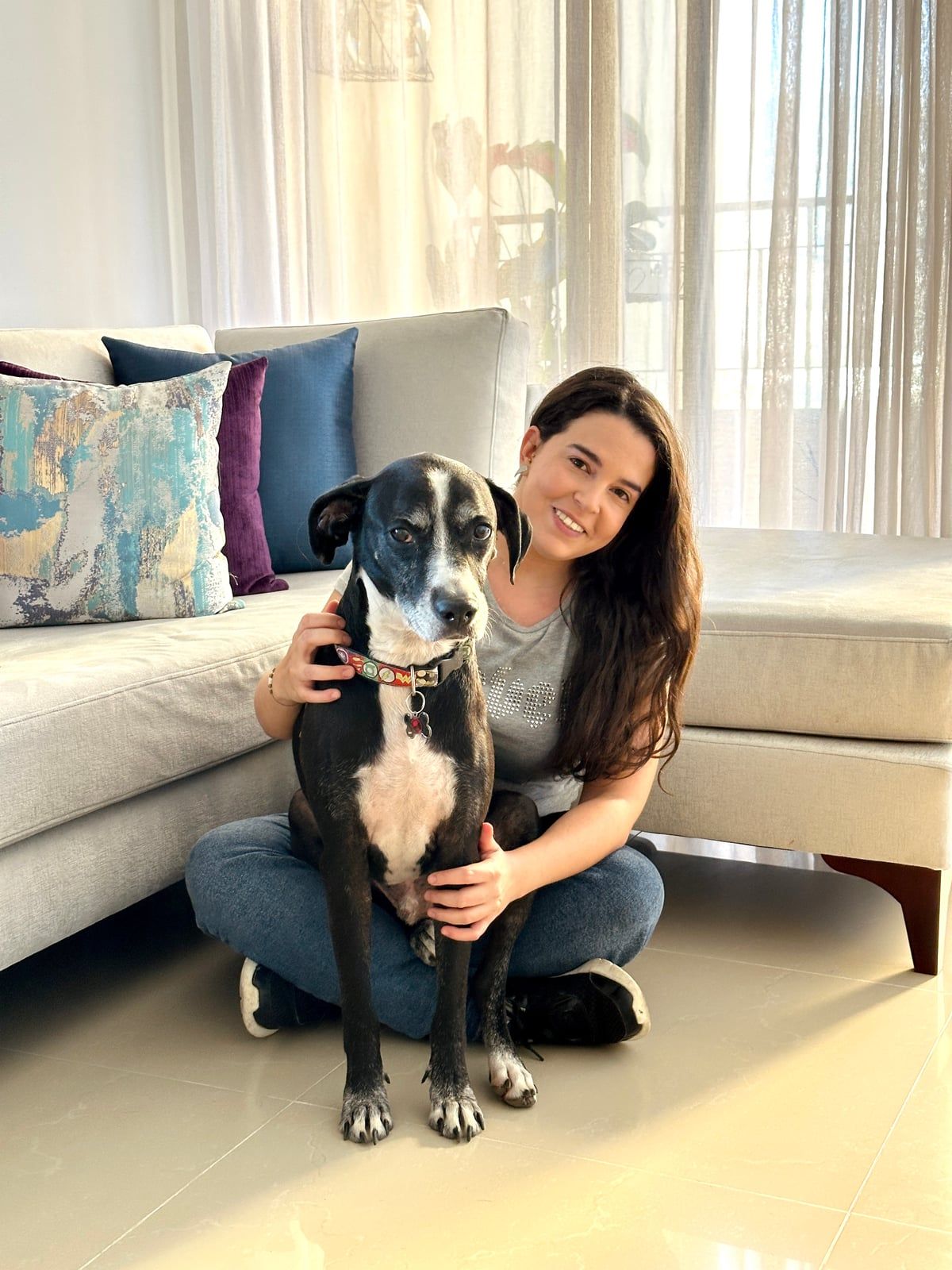 Susana Escobar with dogs at home